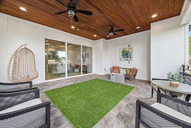 view of patio with ceiling fan and an outdoor hangout area