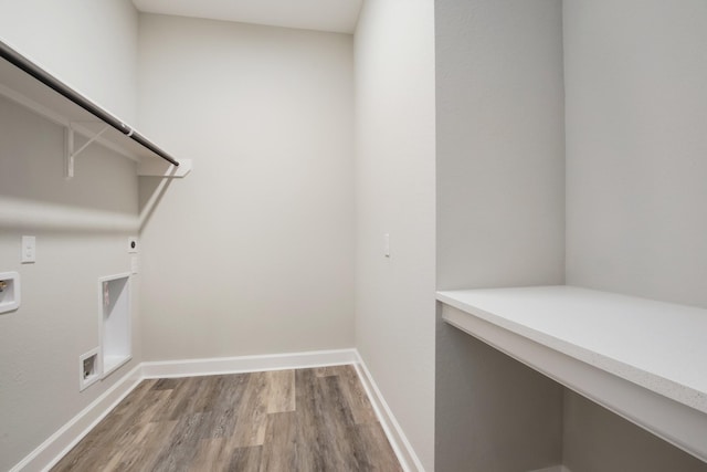 laundry area featuring hookup for a washing machine, wood-type flooring, and hookup for an electric dryer