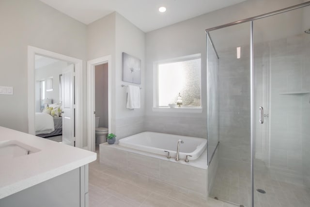 full bathroom with tile patterned flooring, vanity, independent shower and bath, and toilet