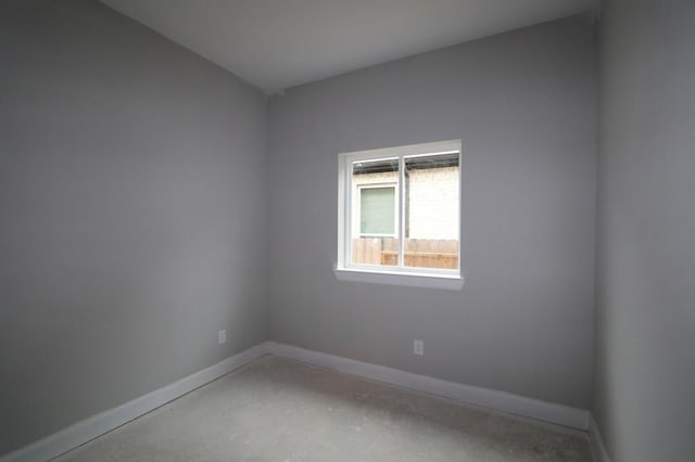 empty room featuring concrete flooring