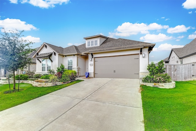 view of front of house featuring a front yard and a garage