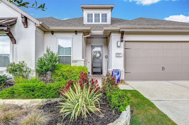 doorway to property featuring a garage