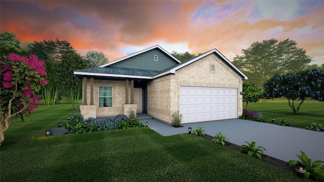 view of front of house with a garage and a yard