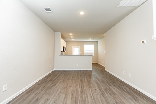 empty room with hardwood / wood-style floors