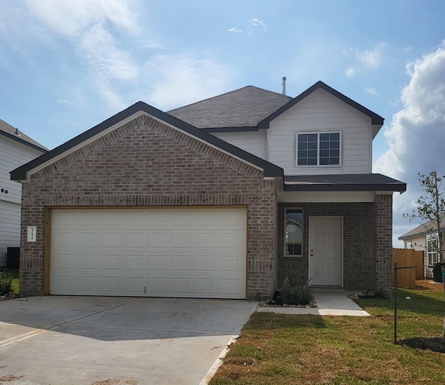 view of front facade featuring a garage and a front yard