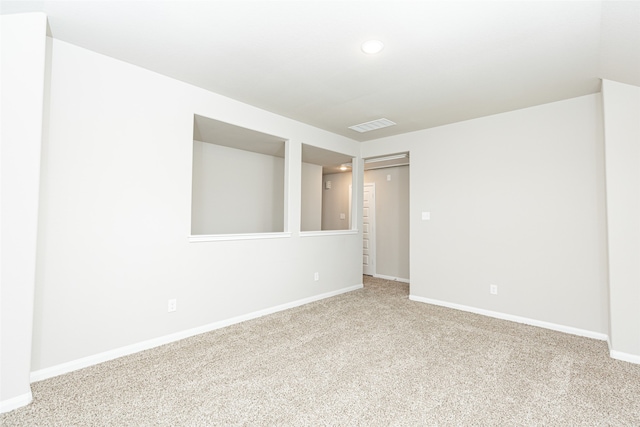 spare room featuring carpet floors