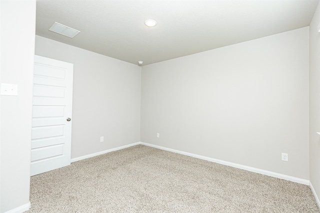 spare room featuring carpet floors