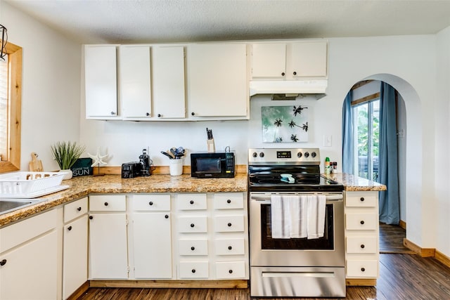 kitchen with dark hardwood / wood-style flooring, white cabinetry, stainless steel electric range oven, and light stone counters