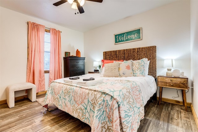 bedroom with hardwood / wood-style flooring and ceiling fan