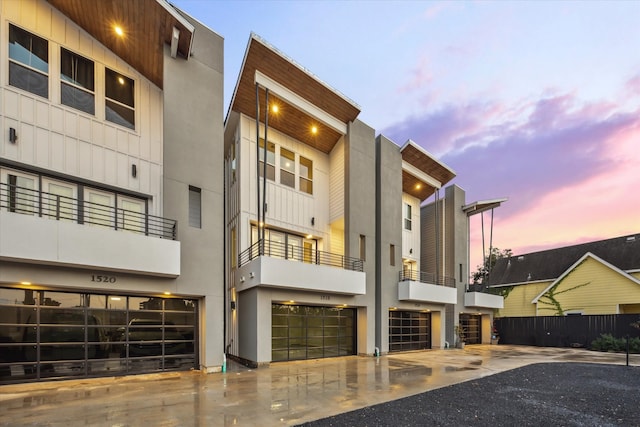 view of outdoor building at dusk