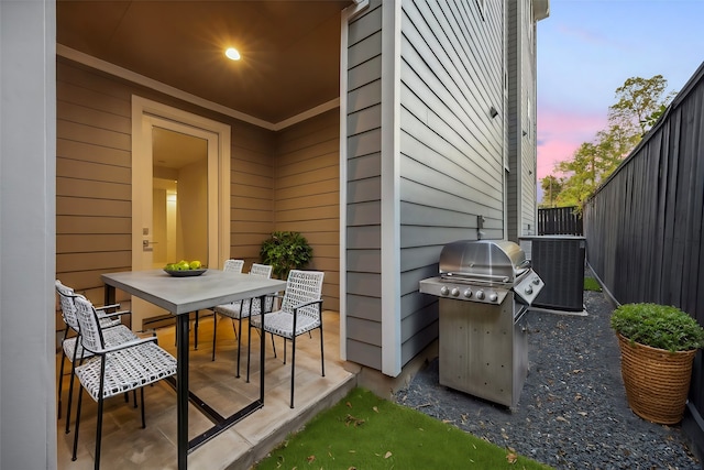 patio terrace at dusk with a grill