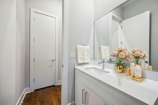 bathroom with vanity and hardwood / wood-style floors