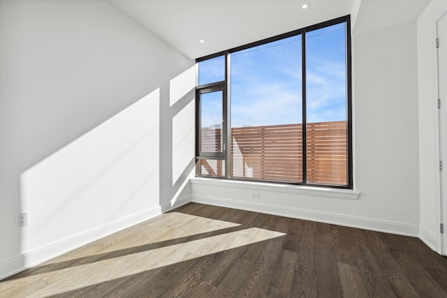 unfurnished room featuring dark hardwood / wood-style floors