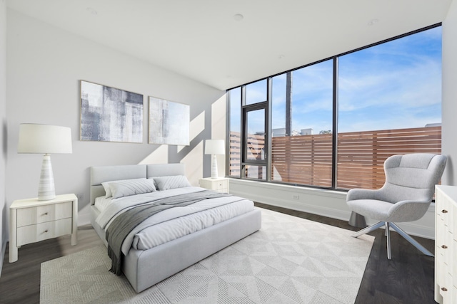 bedroom with hardwood / wood-style floors