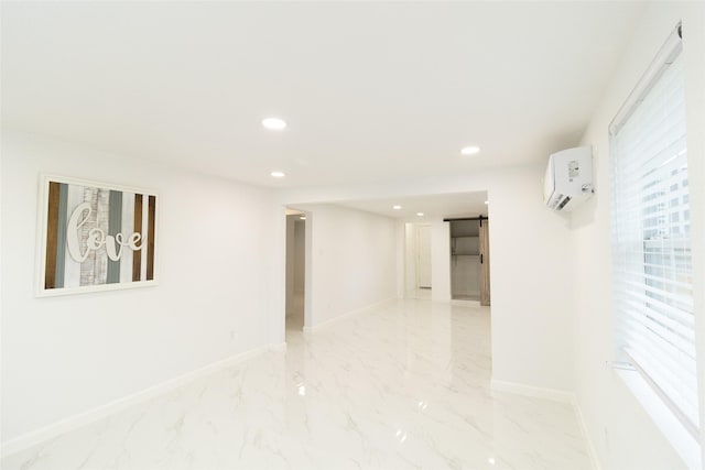 spare room featuring a wall mounted air conditioner