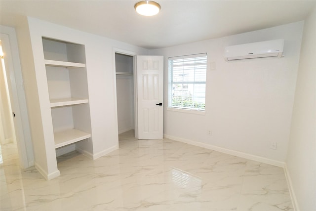 unfurnished bedroom with a wall mounted air conditioner