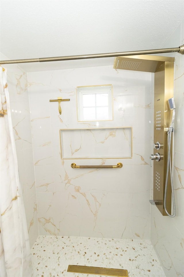 bathroom featuring curtained shower