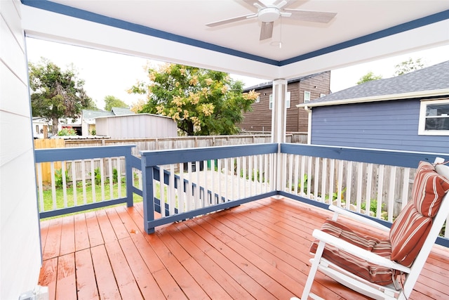 wooden terrace featuring ceiling fan