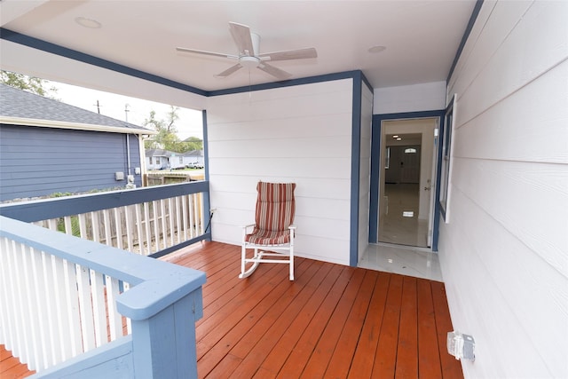 wooden terrace featuring ceiling fan and covered porch