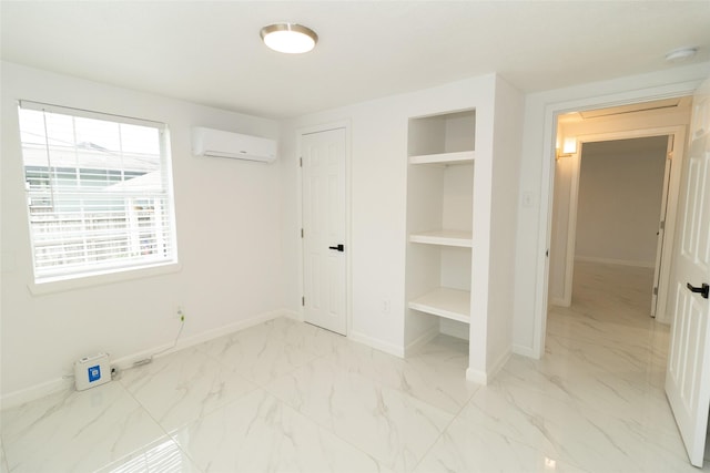 unfurnished bedroom featuring a wall unit AC