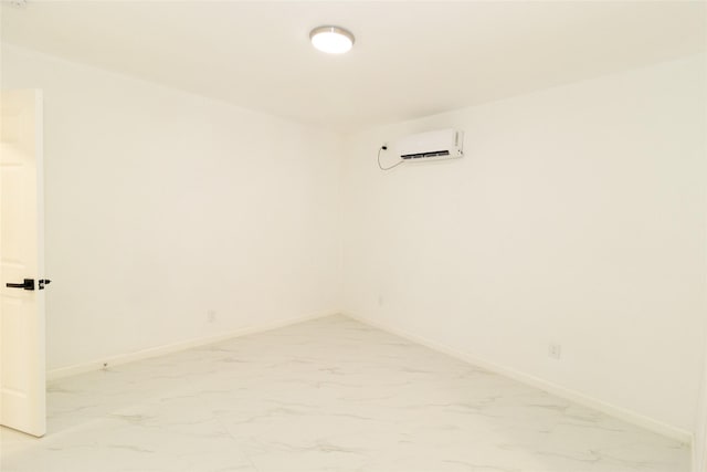 spare room with a wall mounted air conditioner