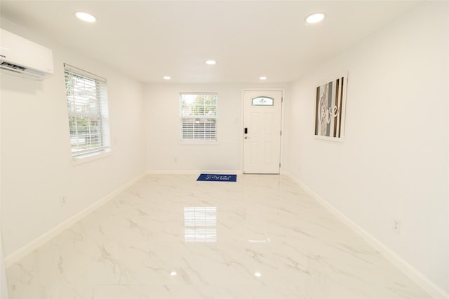 foyer entrance featuring a wall mounted AC