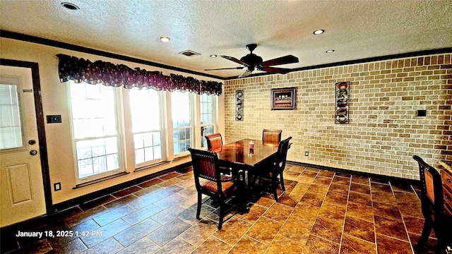 6906 Apple Valley Ln, Houston, TX 77069 - dining room featuring a textured ceiling, brick wall, ceiling fan, baseboards, and crown molding