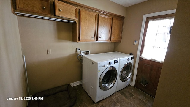 washroom with washing machine and dryer and cabinets