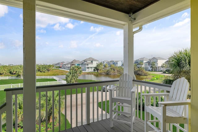 wooden deck featuring a water view