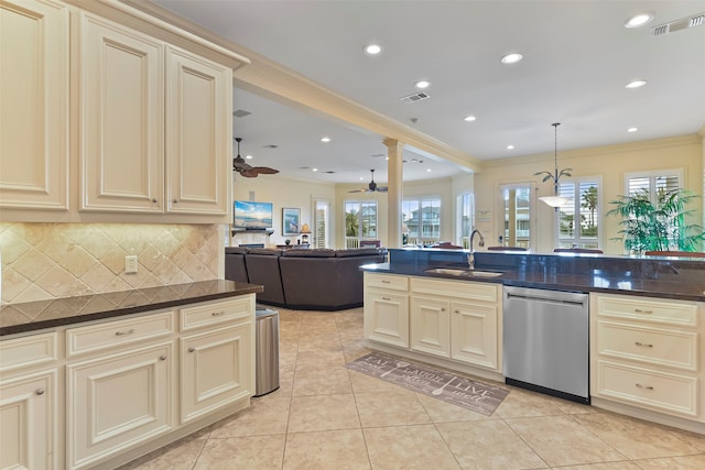 kitchen featuring light tile patterned floors, cream cabinetry, sink, stainless steel dishwasher, and ceiling fan