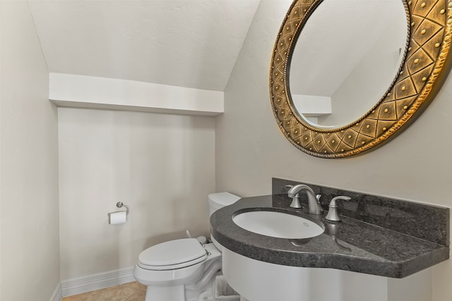 bathroom featuring tile patterned floors, sink, and toilet