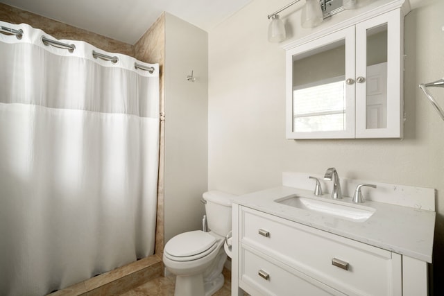 bathroom featuring tile patterned flooring, vanity, a shower with shower curtain, and toilet