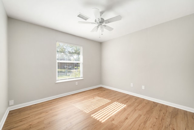 unfurnished room with light hardwood / wood-style flooring and ceiling fan