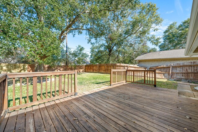 wooden deck with a yard