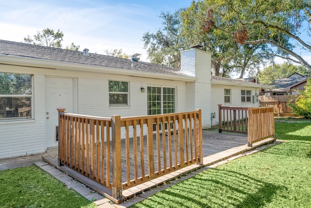 wooden deck with a lawn