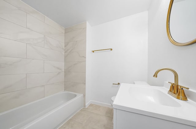 full bathroom with tile patterned flooring, vanity, tiled shower / bath combo, and toilet