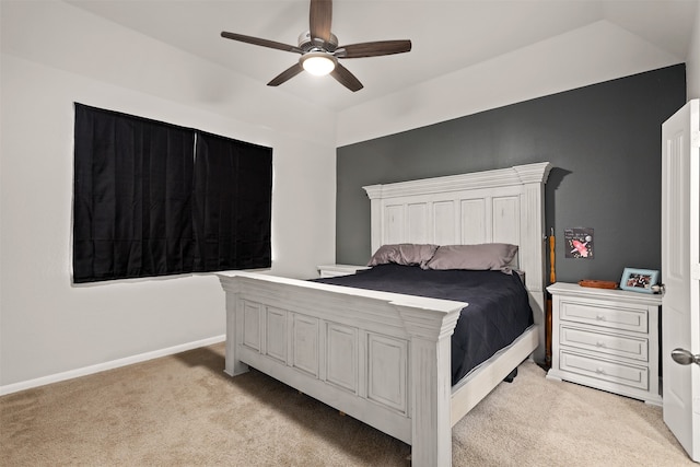 carpeted bedroom with ceiling fan and lofted ceiling