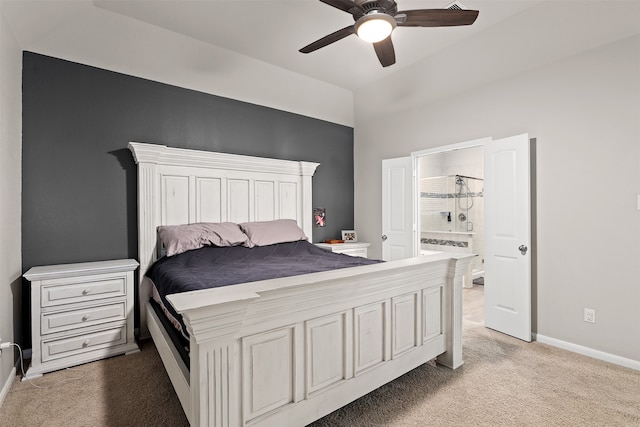 bedroom with ensuite bathroom, ceiling fan, and light carpet