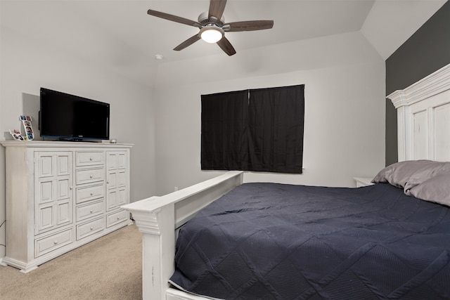 bedroom featuring light carpet, ceiling fan, and vaulted ceiling