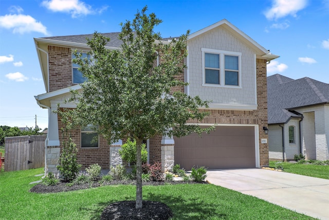 view of front of home featuring a garage and a front yard