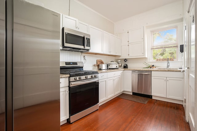 kitchen with white cabinets, sink, and stainless steel appliances