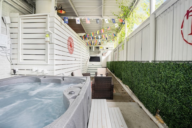 view of patio / terrace featuring a hot tub