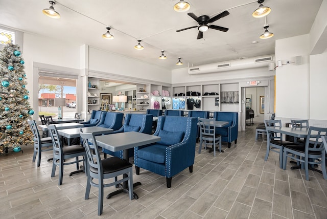 dining area with hardwood / wood-style floors and ceiling fan