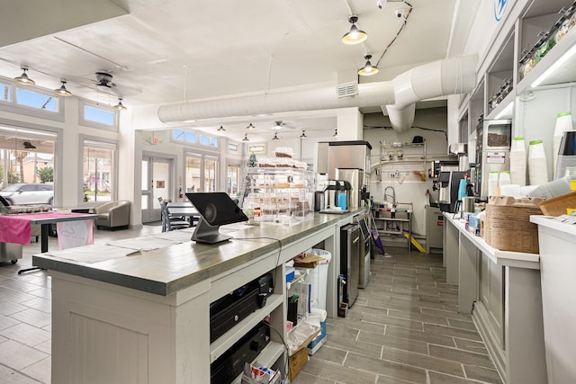 kitchen with hardwood / wood-style floors and ceiling fan