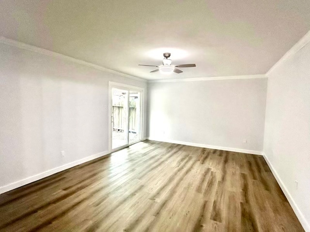 empty room featuring hardwood / wood-style flooring, ceiling fan, and crown molding