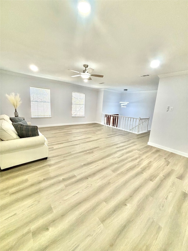 living room featuring ceiling fan and light hardwood / wood-style floors