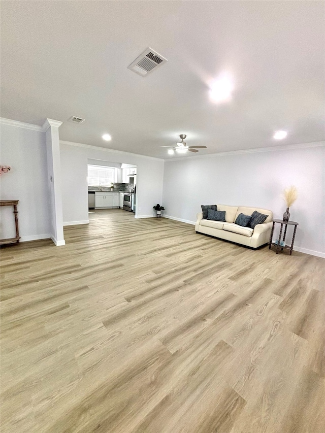 living room with ceiling fan, light hardwood / wood-style flooring, and ornamental molding