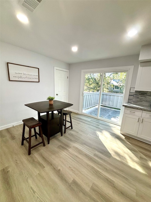 dining space featuring light hardwood / wood-style flooring