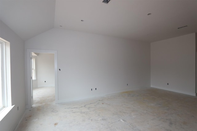 empty room with vaulted ceiling