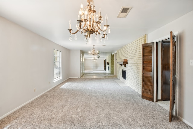 unfurnished living room with a fireplace, light colored carpet, and brick wall